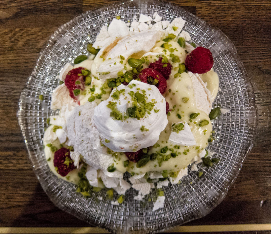 Pistachio meringue with lemon curd and raspberries at Cafe Murano