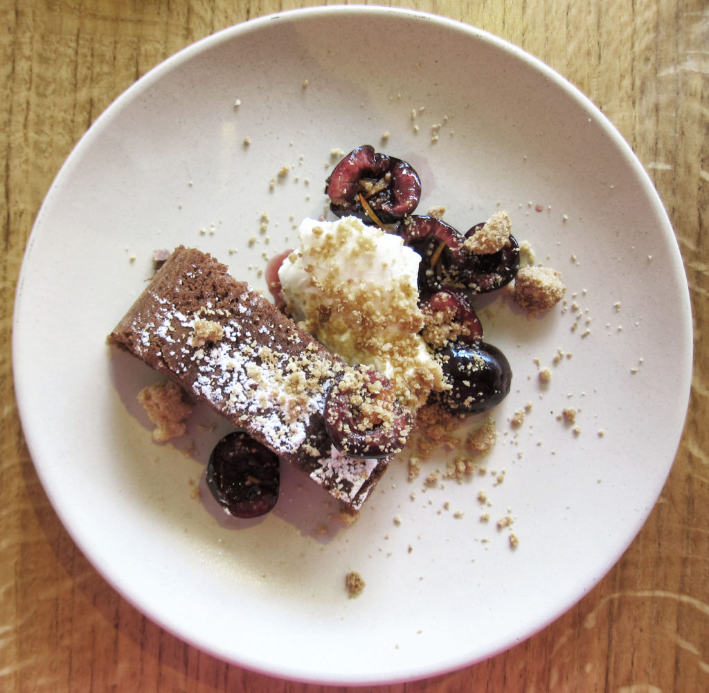 Capri cake with cherries and creme fraiche