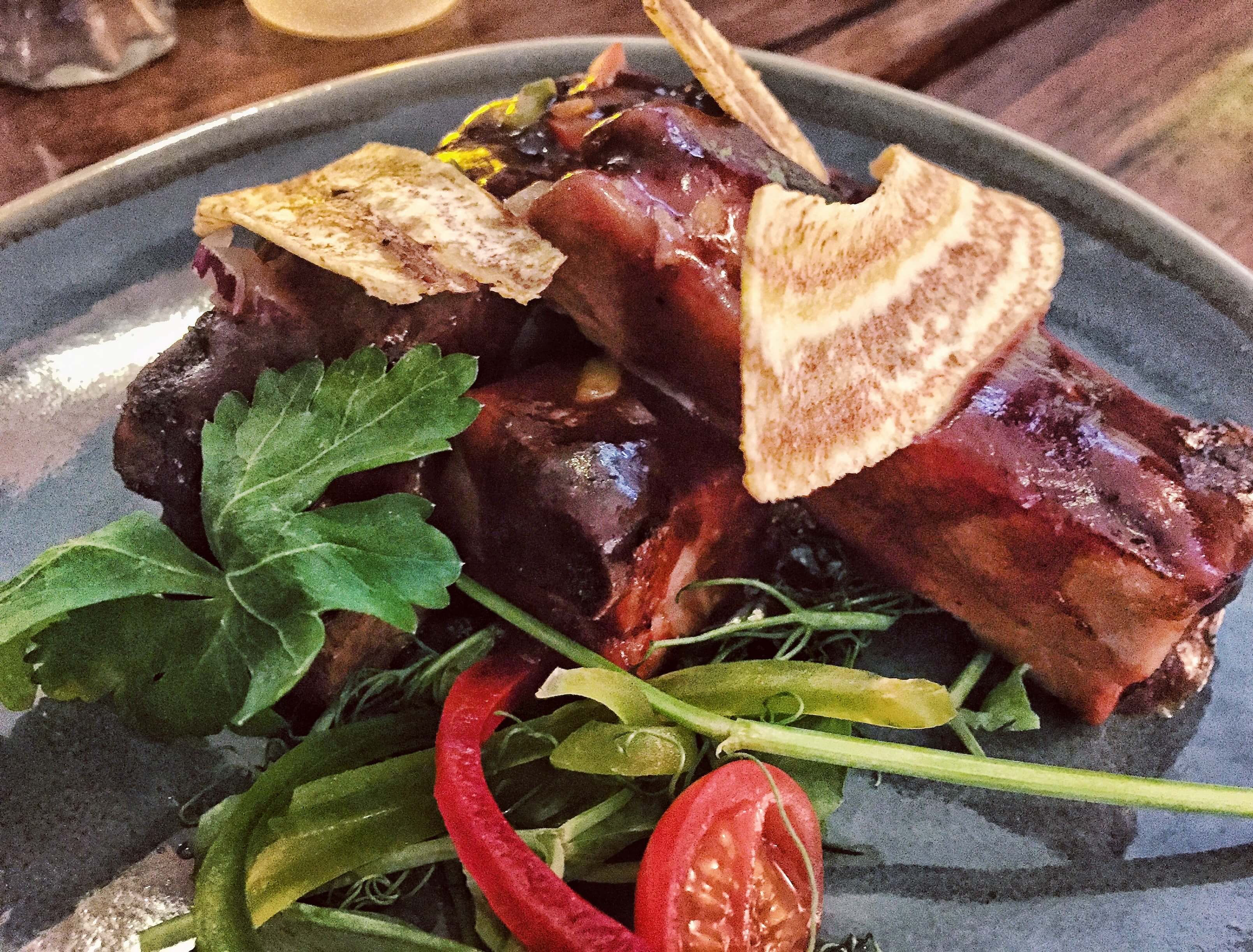 Sticky jerk pork ribs with fried plantain crisps at Cottons Caribbean restaurant in Shoreditch, London